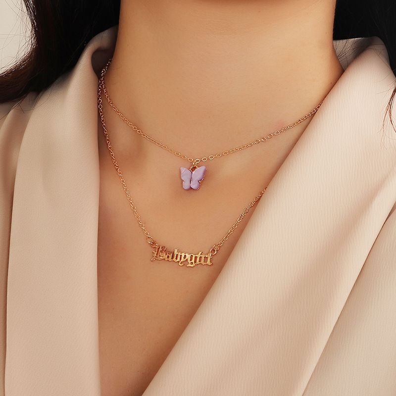 a women wear butterfly name necklace as a new year gift