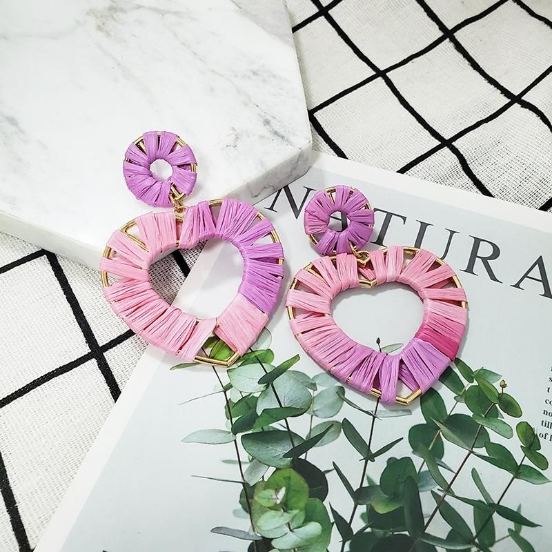 purple and pink heart-shaped earrings made by raffia and alloy for new year wear